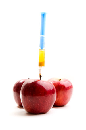 Red apples with syringeの写真素材