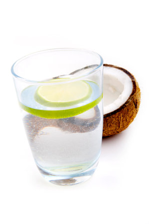 Glass of water with lime and coconut