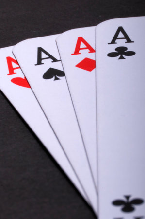 Poker game with asses and black backgroundの写真素材