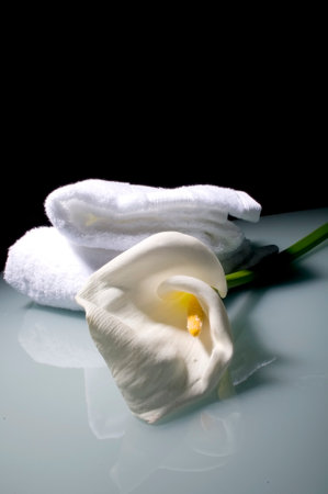 White lily flower with towels on glassの写真素材