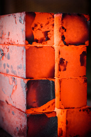 piles of hot iron blocks in foundry. Narrow focus on central blockの写真素材