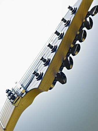 closeup of electric guitar and fretboard. Vertical shape, studio shot, selective focusの写真素材