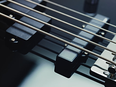 closeup of black five cords electric bass and pickups. Horizontal shape, studio shotの写真素材