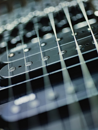 closeup of black electric guitar and pickups. Vertical shape, studio shot, selective focusの写真素材