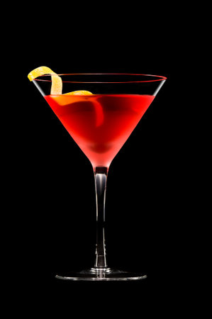 Cosmopolitan cocktail in nice red color in front of a black backgroundの写真素材