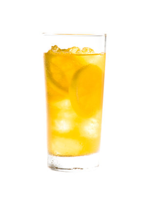 Chilled lemon ice tea over white in nice yellow colorの写真素材