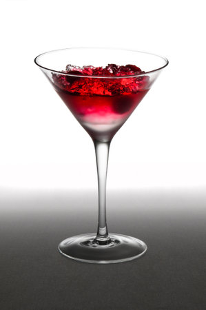 Raspberry cocktail in a martini glass, over whiteの写真素材