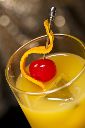 Harvey Wallbanger Cocktail in front of different colored backgroundsの写真素材