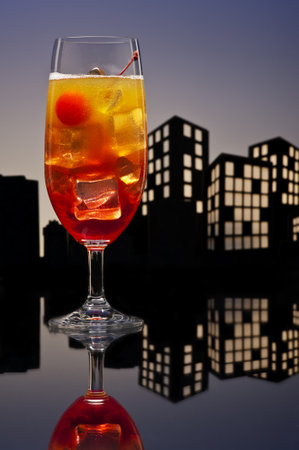 Metropolis Tequila Sunrise cocktail in city skyline settingの写真素材
