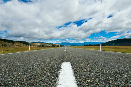 Highway through the countryside during a cloudy dayの写真素材