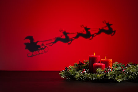 Santas sledge on his way to deliver presents and candlesの写真素材