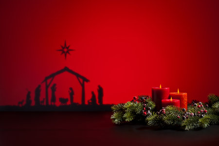 Birth Jesus silhouette of the crib in Bethlehem and candlesの写真素材