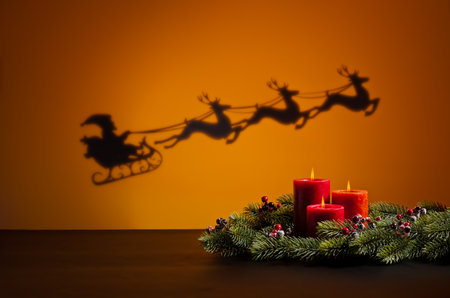 Santas sledge on his way to deliver presents and candlesの写真素材
