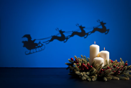 Santas sledge on his way to deliver presents and candlesの写真素材