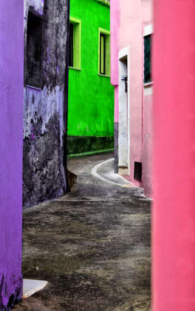 Photo of italian street with multi colored houses on itの写真素材