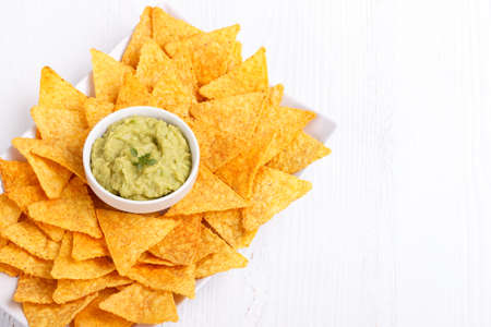 Guacamole with corn chips wooden background copy spaceの写真素材