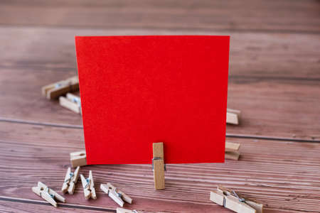 Blank Square Note Surrounded By Laundry Clips Showing New Meaning.の写真素材