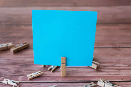 Blank Square Note Surrounded By Laundry Clips Showing New Meaning.の写真素材