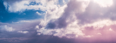 Beautiful blue and pink cloudscape, amazing view on the heaven, fluffy clouds in sunset lights, abstract natural background..の写真素材