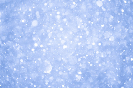 Abstract Blue Christmas Background with Real Snow. Blurred Snowflakes Photo.の写真素材