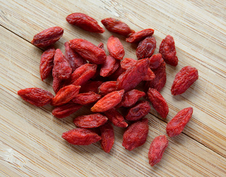 Heap of Dry Goji Berries on the Wooden Table. Healthy Dietの写真素材