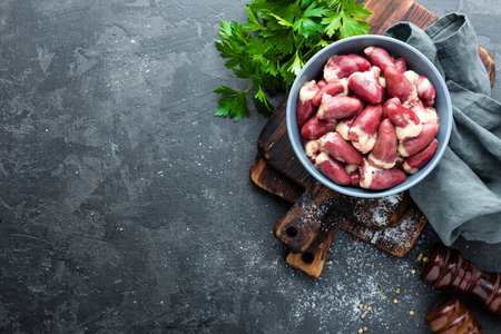 raw chicken heartsの写真素材