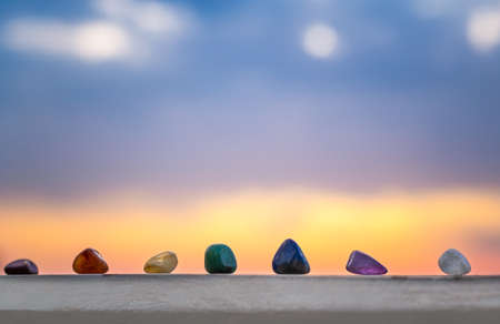 Crystals, energy stones for meditation over sunset background, inner peace, chakra cleansing and balance concept..の写真素材