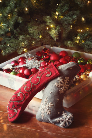 Stockings and ornaments ready to decorate the christmas treeの写真素材