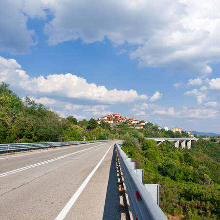 Asphalt Road Leading to the Medieval Italian City of Pratoの写真素材
