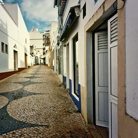 Patterned Pavement in the Medieval Portuguese City of Logos, Vintage Style Toned Pictureの写真素材