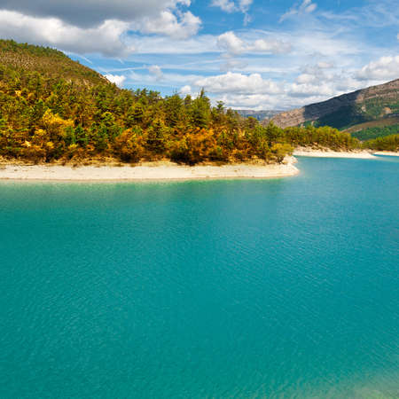 Wooded Shore of the Lake in French Alpsの写真素材