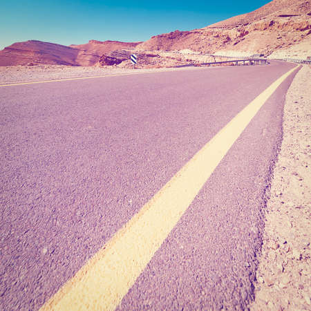 Winding Asphalt Road in the Negev Desert in Israel, Instagram Effectの写真素材