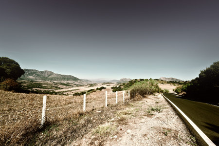Winding Asphalt Road in the Cantabrian Mountain in Spain, Vintage Style Toned Picture
