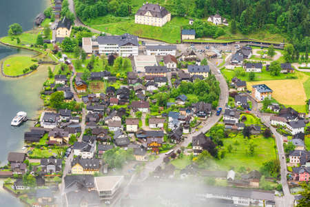 Rain and clouds on the Hallstattersee in Austria. Bird's eye view of the morning mist over the Austrian city of Hallstatt.の写真素材
