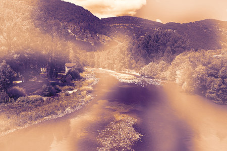 Deserted landscape in France in a contemporary style. Lack of tourists on the banks of a mountain river in the French Alps.の写真素材