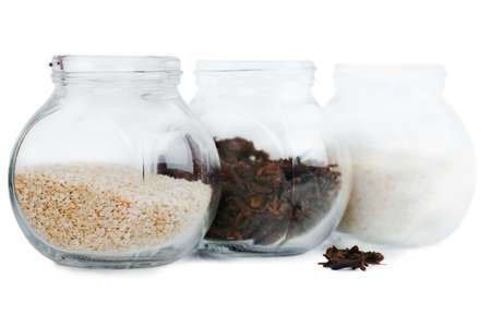 Closeup view of small glass jars with spicesの写真素材