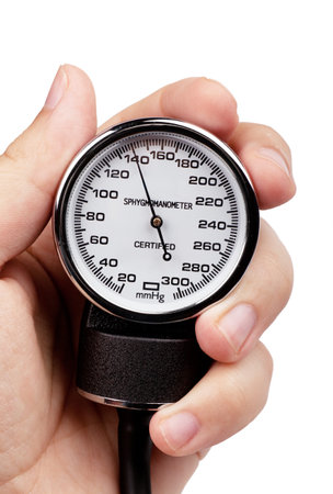 Medical instrument tonometer in a hand over white background