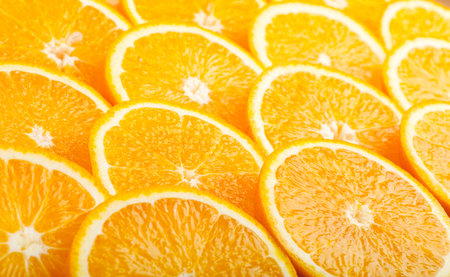 Abstract background with fresh juicy orange slices