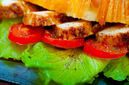 savory croissant brioche bread with chicken breast and vegetable rustic styleの写真素材