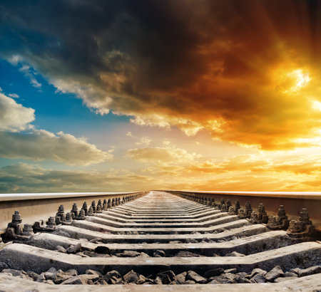 railway to horizon under sunset