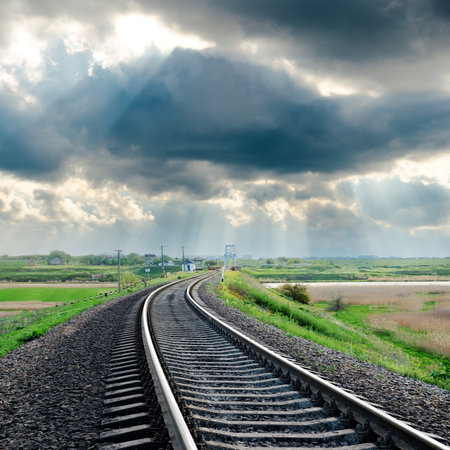 railroad and rainy clouds over itの写真素材