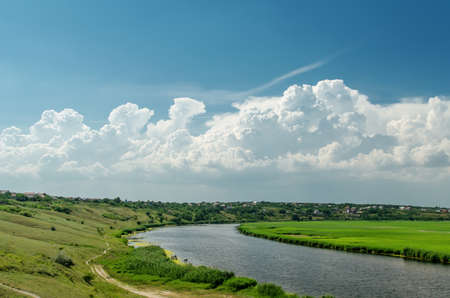 river under cloudy skyの写真素材