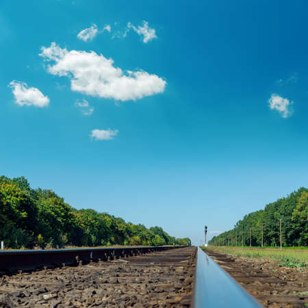 old railroad closeup under deep blue skyの写真素材