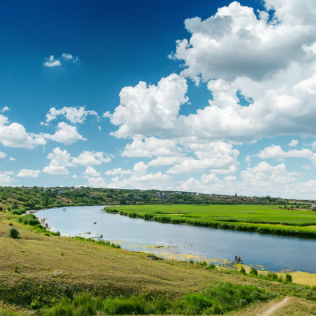 clouds on blue sky over river