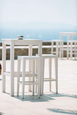 Summer empty open air cafe near sea at greek islandの写真素材