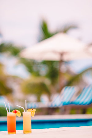 Two tasty alcoholic cocktails on tropical white beach