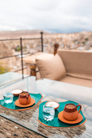 Cup with traditional Turkish coffee on a background of a valley in Cappadocia, Turkey.
