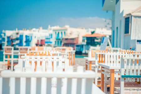 Outdoor cafe on a street of typical greek traditional village in Greece.