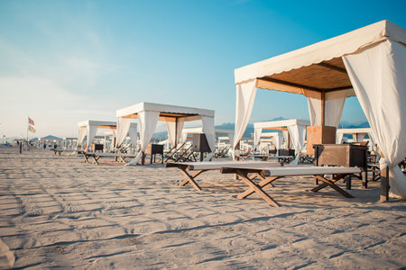 Luxury sun beds in the evening lightsの写真素材