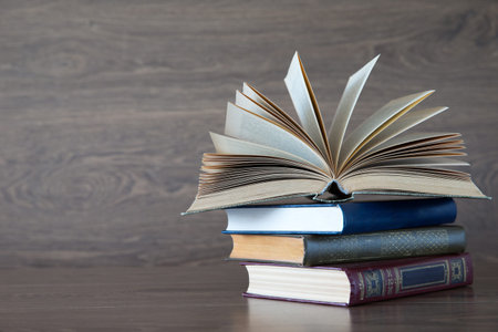 books on wooden deck tabletop